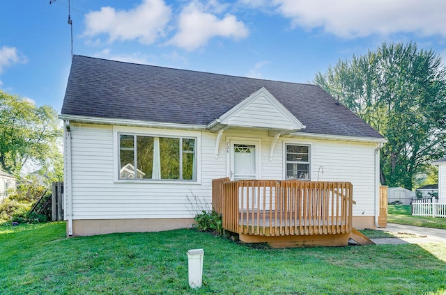 view of front of home featuring a deck and a front yard