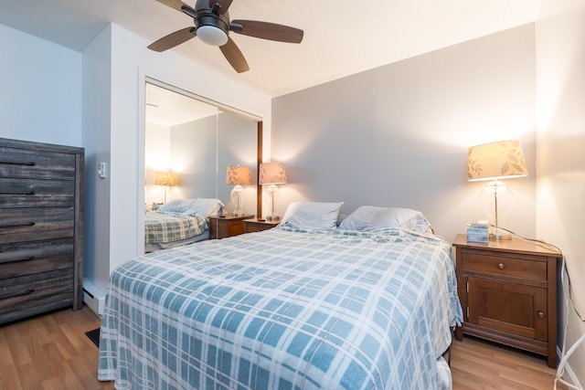 13730 Seminole Path, Lakeview, OH 43331 - bedroom with light wood-style flooring, a closet, and a ceiling fan