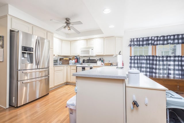 13730 Seminole Path, Lakeview, OH 43331 - kitchen with stainless steel fridge with ice dispenser, white microwave, range with electric stovetop, recessed lighting, and a ceiling fan
