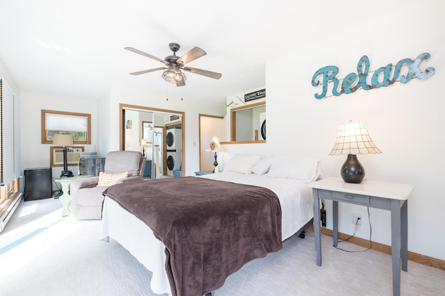 13730 Seminole Path, Lakeview, OH 43331 - bedroom featuring stacked washer / dryer, carpet flooring, a closet, and ceiling fan