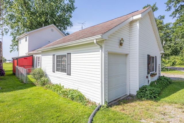 13730 Seminole Path, Lakeview, OH 43331 - view of home's exterior with an outdoor structure, a garage, and a shingled roof