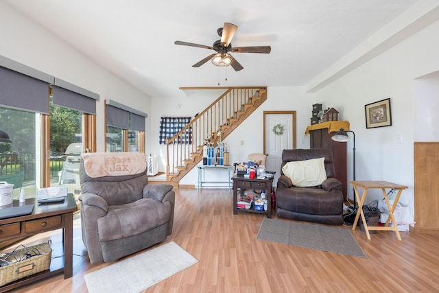 13730 Seminole Path, Lakeview, OH 43331 - living room with stairs, light wood-style floors, and ceiling fan