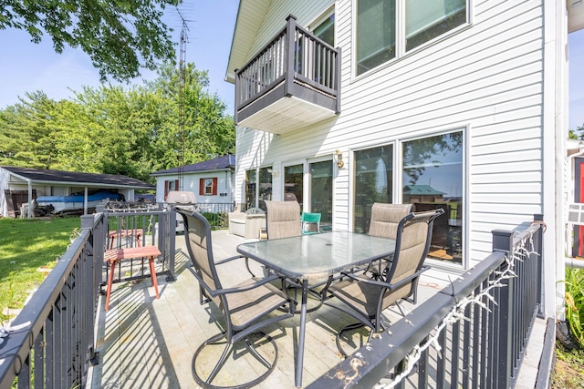 13730 Seminole Path, Lakeview, OH 43331 - wooden terrace with outdoor dining area and a yard