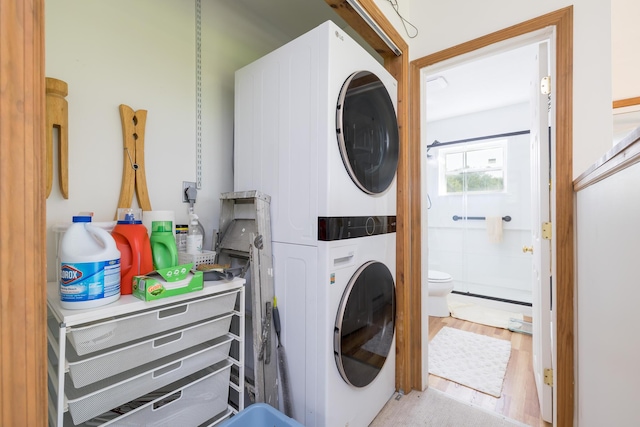 13730 Seminole Path, Lakeview, OH 43331 - laundry room with estacked washer and dryer and wood finished floors
