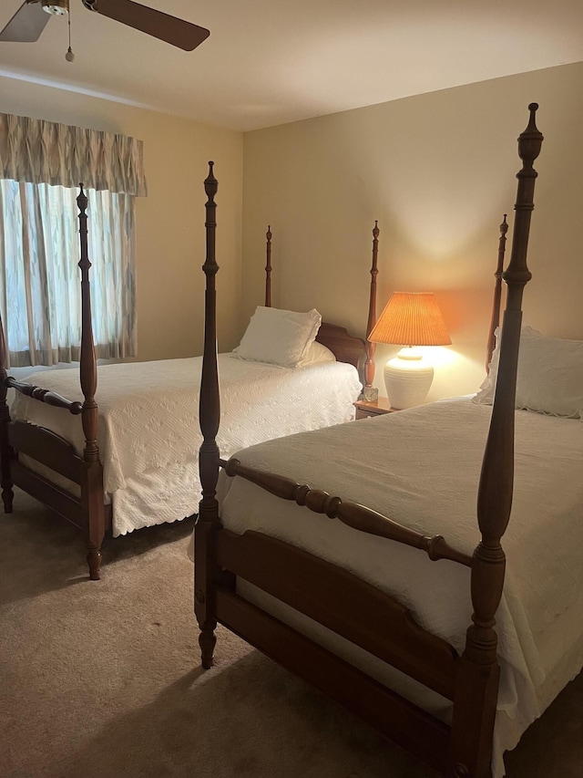 bedroom with carpet floors and a ceiling fan