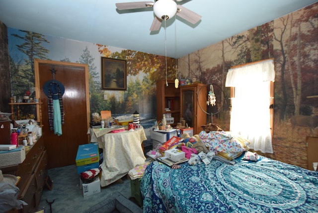 bedroom featuring ceiling fan and carpet flooring