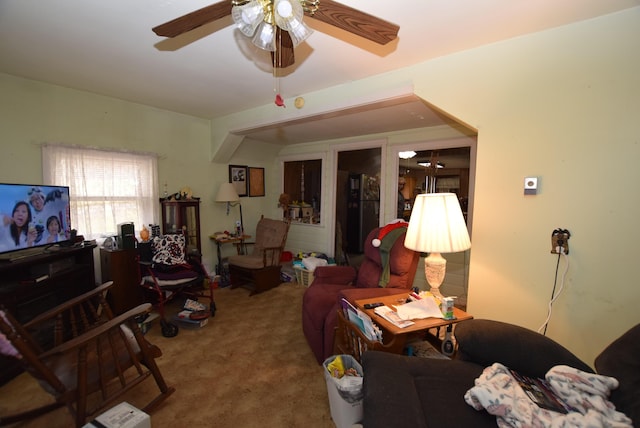 living room featuring ceiling fan and carpet flooring