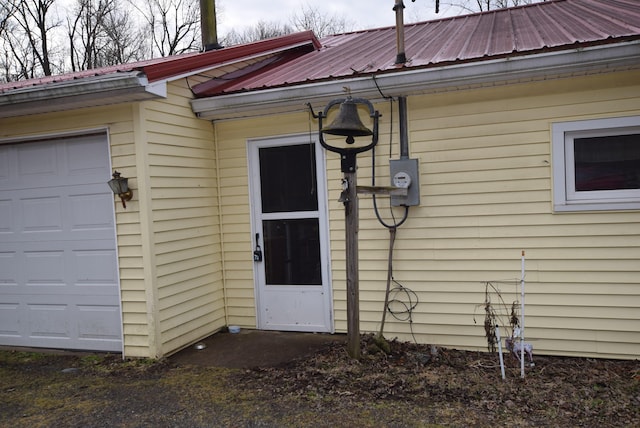 view of exterior entry featuring a garage