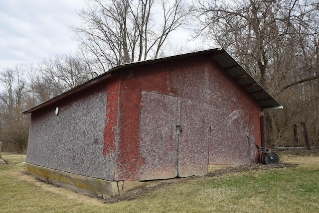 view of outdoor structure with a lawn