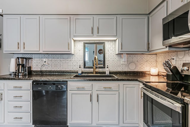 kitchen featuring a sink, electric range, stainless steel microwave, dishwasher, and decorative backsplash
