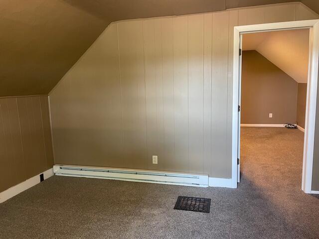 9770 Agerter Rd, Spencerville, OH 45887 - bonus room with carpet, vaulted ceiling, and a baseboard heating unit