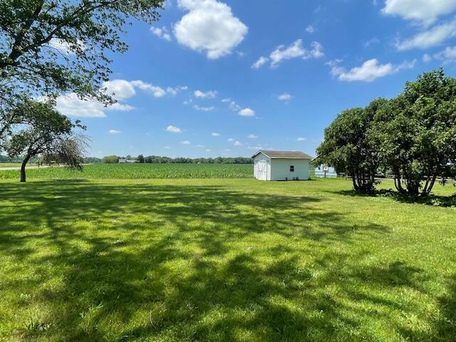 9770 Agerter Rd, Spencerville, OH 45887 - view of grassy yard featuring a view of rural / pastoral area and a storage unit