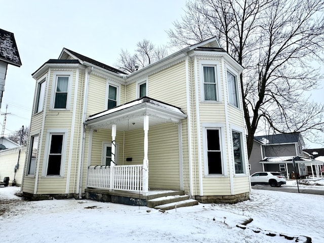 victorian house featuring covered porch