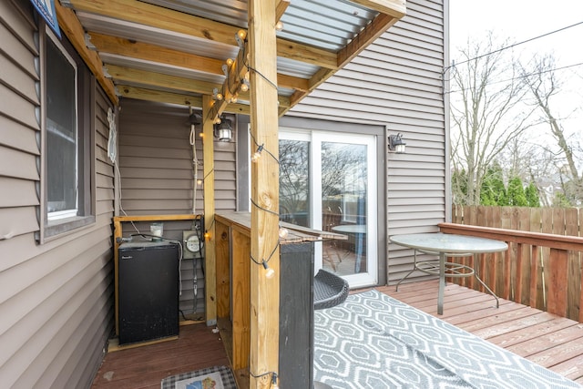 wooden deck featuring fence