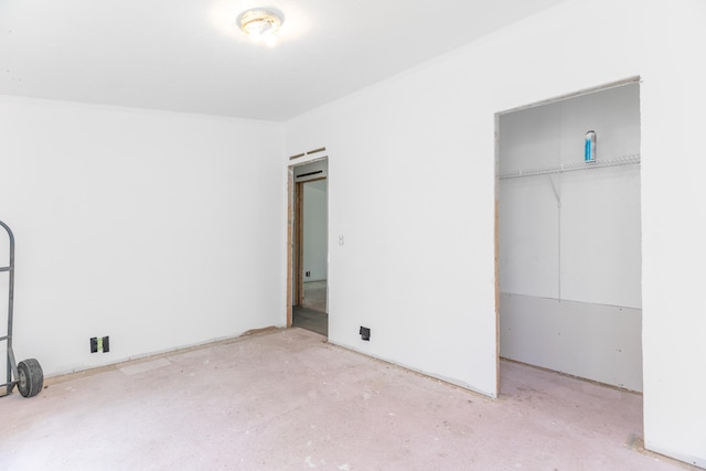 13253 State Route 720, Lakeview, OH 43331 - unfurnished bedroom featuring unfinished concrete flooring and a closet