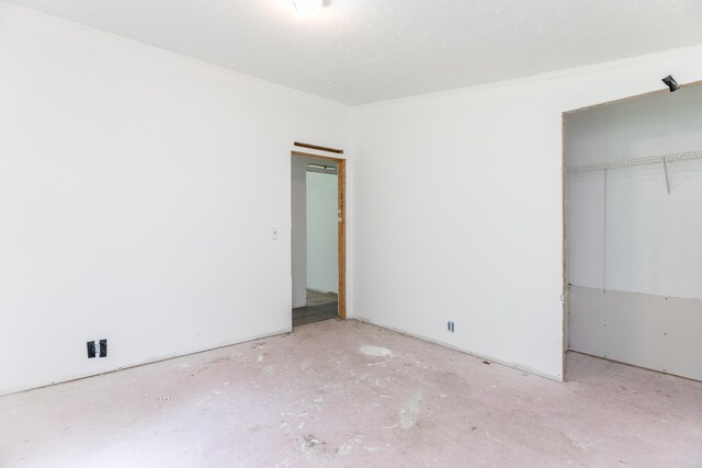 13253 State Route 720, Lakeview, OH 43331 - unfurnished bedroom with a closet and concrete floors