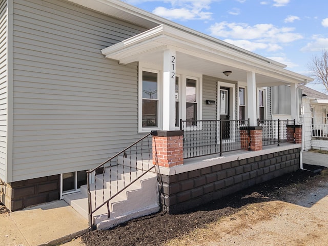 doorway to property with a porch