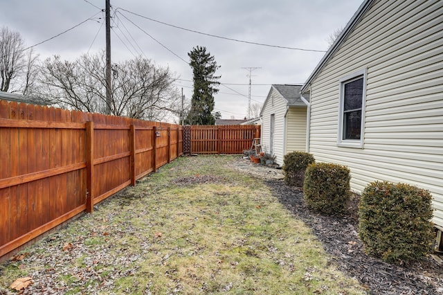 view of yard with a fenced backyard