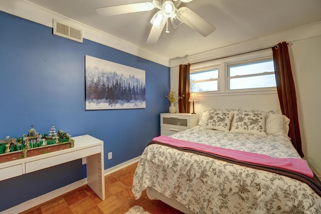 bedroom with visible vents, baseboards, and a ceiling fan