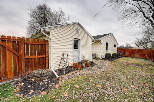 view of property exterior featuring a gate and fence