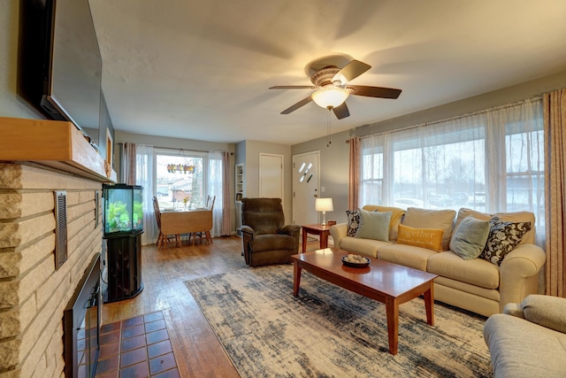 living room featuring hardwood / wood-style flooring and ceiling fan