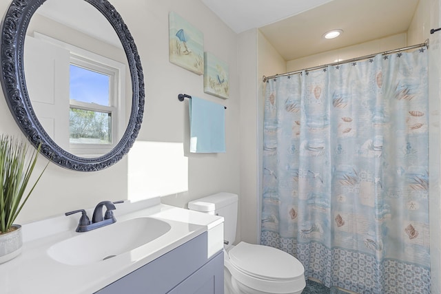 bathroom featuring toilet, recessed lighting, curtained shower, and vanity