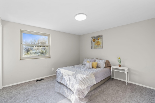 bedroom with carpet flooring, baseboards, and visible vents