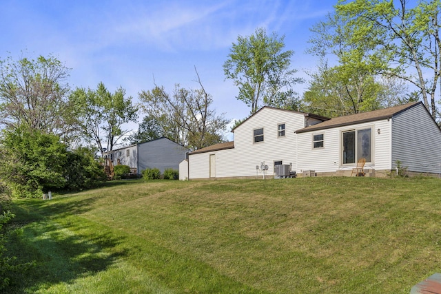 back of property featuring a yard and cooling unit