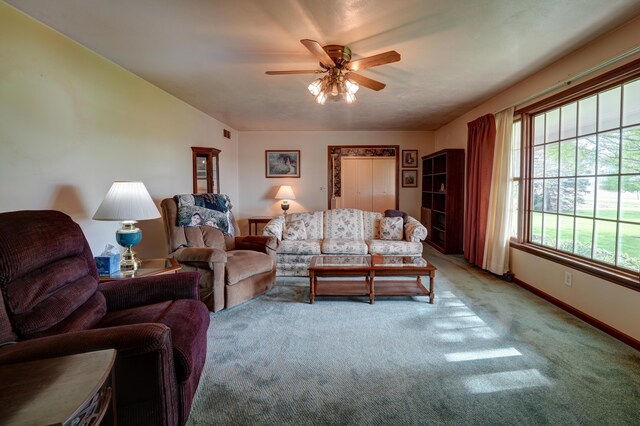9743 State Route 118, Ansonia, OH 45303 - living room featuring light colored carpet, ceiling fan, and baseboards