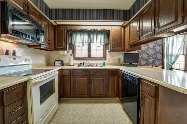 9743 State Route 118, Ansonia, OH 45303 - kitchen featuring black appliances, a sink, healthy amount of natural light, light countertops, and wallpapered walls