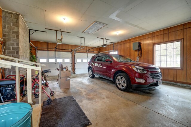 9743 State Route 118, Ansonia, OH 45303 - garage with a garage door opener and wooden walls