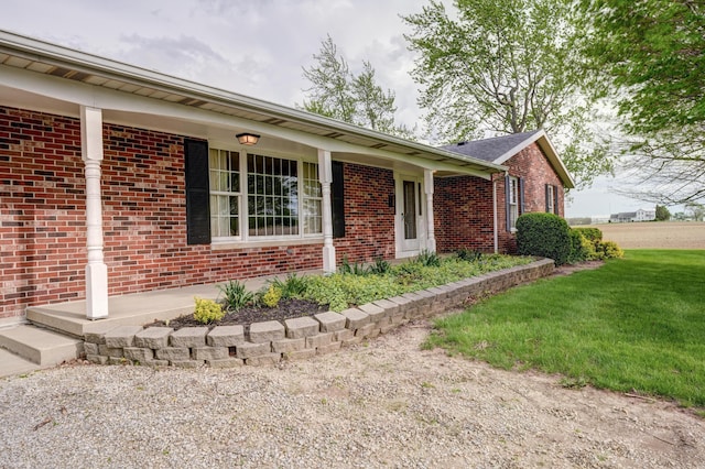 9743 State Route 118, Ansonia, OH 45303 - view of front facade featuring brick siding and a front yard