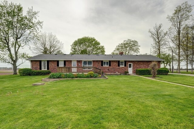 9743 State Route 118, Ansonia, OH 45303 - single story home with brick siding, a front lawn, and a deck