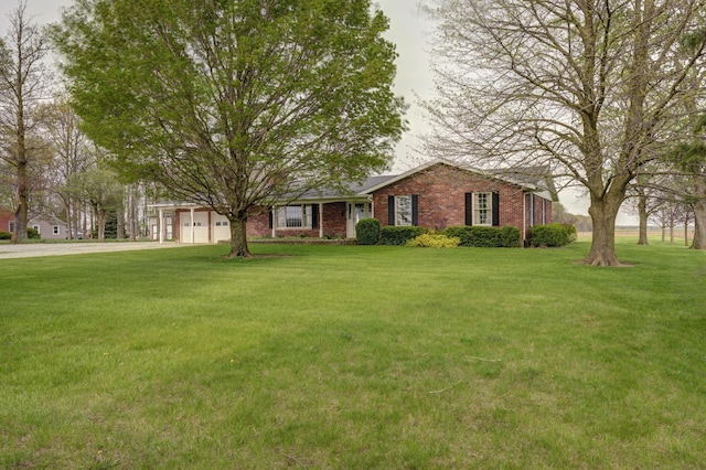 9743 State Route 118, Ansonia, OH 45303 - single story home featuring brick siding, a front yard, and driveway