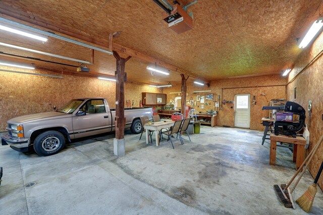 9743 State Route 118, Ansonia, OH 45303 - garage featuring a workshop area and a garage door opener