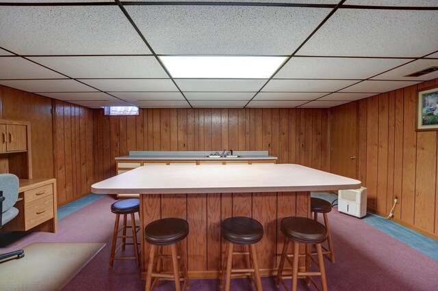 9743 State Route 118, Ansonia, OH 45303 - bar featuring a drop ceiling, dark carpet, wood walls, and a sink
