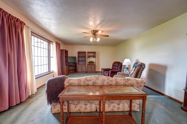 9743 State Route 118, Ansonia, OH 45303 - carpeted living area featuring baseboards and ceiling fan