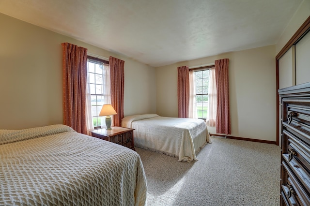9743 State Route 118, Ansonia, OH 45303 - carpeted bedroom with multiple windows and baseboards