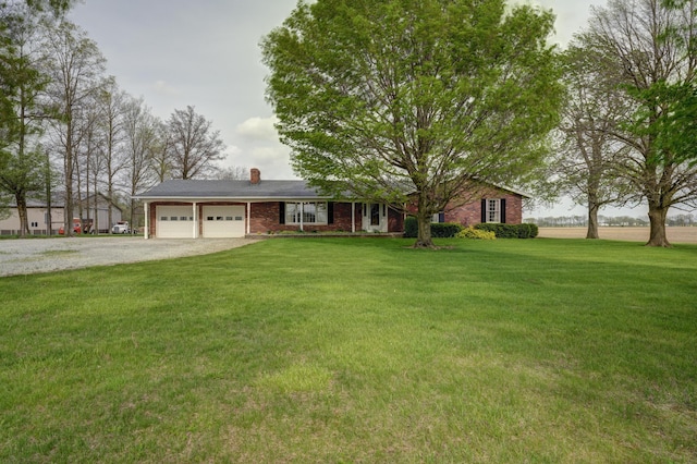 9743 State Route 118, Ansonia, OH 45303 - ranch-style house with an attached garage, driveway, a chimney, and a front yard