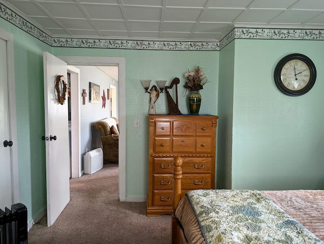 carpeted bedroom with baseboards