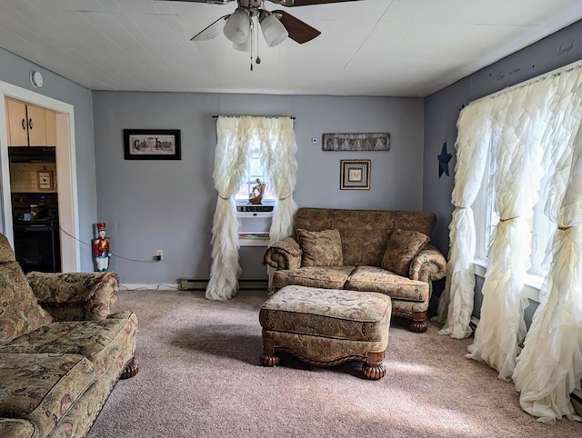 carpeted living area with ceiling fan and cooling unit