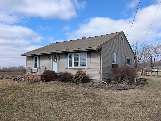 view of front of home with a front yard