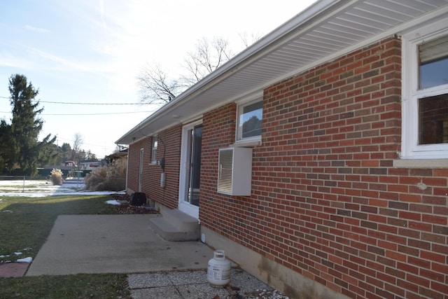 view of side of property with a patio area