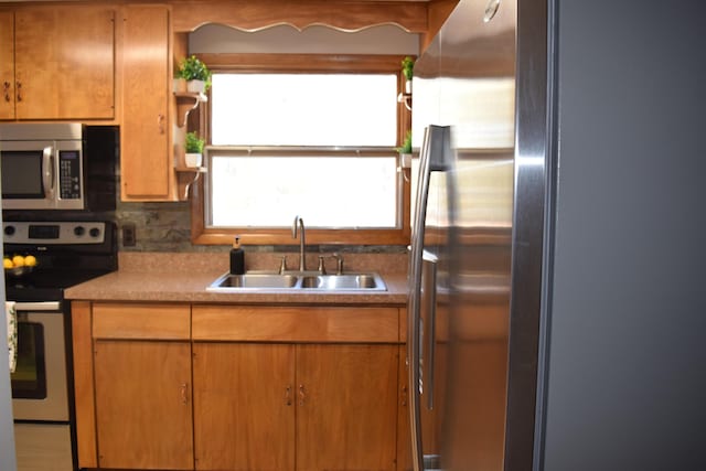 kitchen with appliances with stainless steel finishes and sink