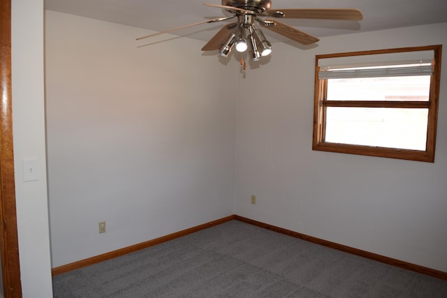 carpeted empty room featuring ceiling fan