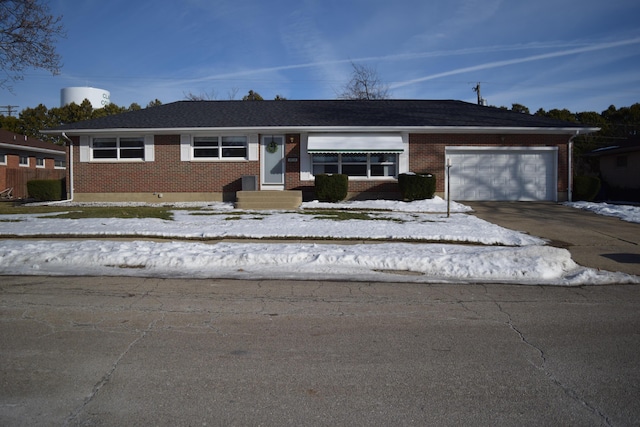 ranch-style house featuring a garage