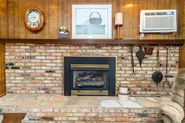 room details with a brick fireplace and a wall mounted AC