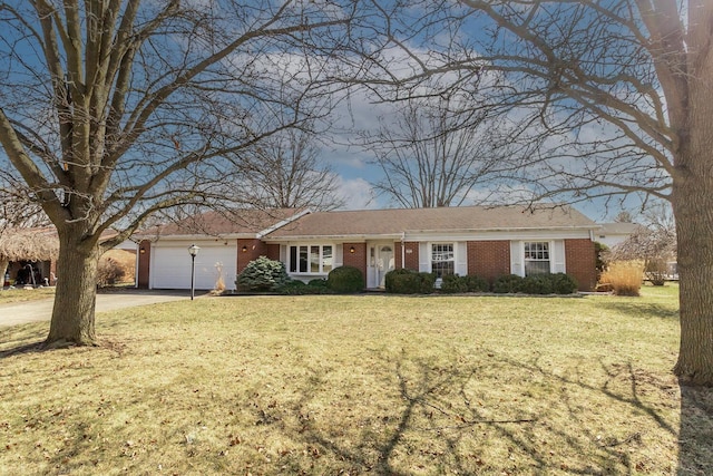 ranch-style house featuring brick siding, driveway, a front yard, and a garage