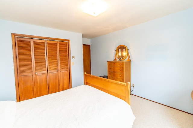 carpeted bedroom featuring a closet