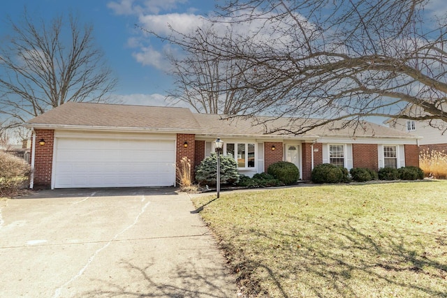 single story home featuring concrete driveway, an attached garage, brick siding, and a front yard